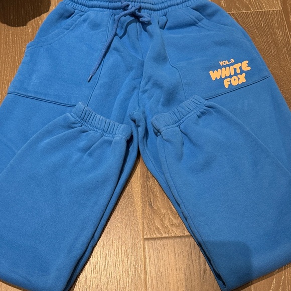 White Fox Boutique Pants - White Fox Boutique Blue Sweatpants with Orange Logo